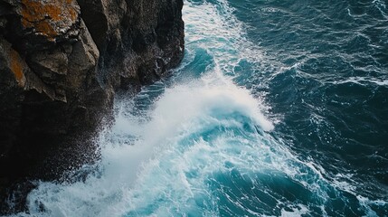 Wall Mural - waves crashing against rocky cliffs in a coastal scene.