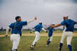 © Jacob Lund - Excited baseball team celebrating as winners on the field after league victory