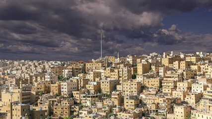 Wall Mural - View of the modern houses Amman, Jordan, Middle East. Against the background of a beautiful sky with clouds. 4K, time lapse