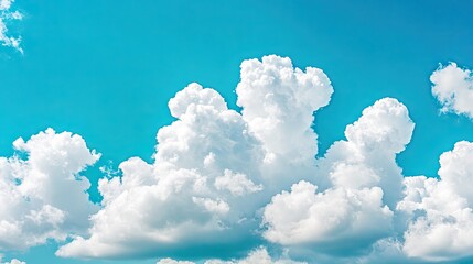 Wall Mural - fluffy clouds surround a clear blue sky, creating a soft, natural frame with an open space in the ce