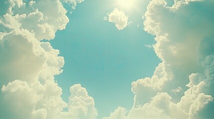 Wall Mural - white clouds creating a soft, natural frame around a vibrant blue sky. the open center is perfect fo