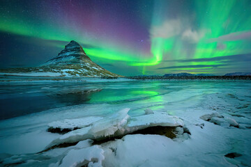 Wall Mural - aurora borealis or northern lights over kirkjufell mountain in iceland