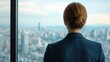 © Peter@studio5 - A business traveler looking out the window of a high-rise hotel suite at the city below close up   Reflection and relaxation in between meetings   ethereal   Blend mode   City view