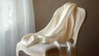 © 69 Timeless  Studio  - A cream-colored silk scarf draped over a chair, with fine textures of the fabric and soft lighting