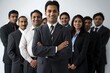 © Viktor - Group of 9 professionals in business attire stand together in line against white background. 6 wear suits, 3 wear ties. Unity and purpose in their stance.