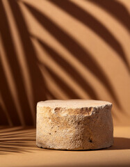Wall Mural - sandstone podium for luxury product placement with palm leaf shadow in background natural stone mate