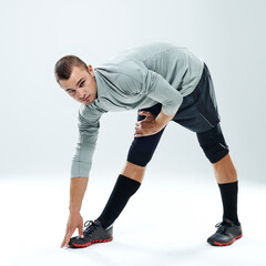 Poster - Portrait, stretching and man with fitness, training and athlete on white studio background. Face, person and model with exercise, workout and challenge with wellness, cardio and balance with health