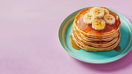 Wall Mural -  Pancake stack with bananas and syrup on a blue plate on a pink cloth against a pink background