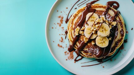 Canvas Print -   A white plate topped with a stack of pancakes covered in chocolate syrup and sliced bananas, and drizzled with chocolate