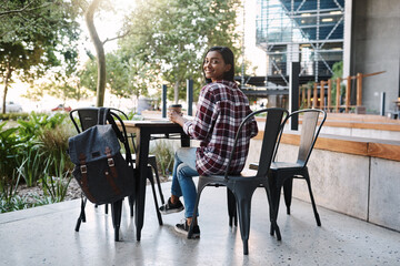 Canvas Print - Woman, portrait and student at university cafe, outdoor studying and espresso for energy at college. Female person, books and campus coffee shop for research on course assignment, India and education