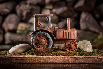 creative photography of an old iron toy tractor