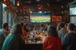 © itchaznong - A group of people are watching a football game at a bar