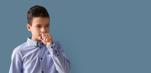 Canvas Print - Coughing little boy on blue background with space for text