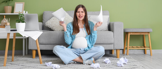 Poster - Stressed pregnant businesswoman with papers at home