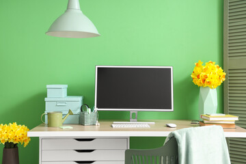 Sticker - Interior of stylish office with workplace and daffodils in vases