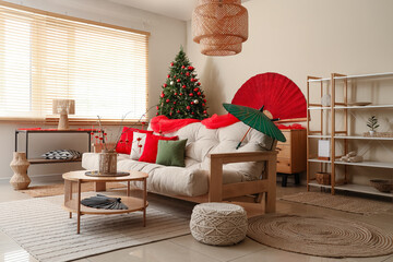 Sticker - Interior of light living room with sofa, fir tree and decor for Japanese New Year celebration