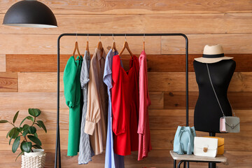 Wall Mural - Interior of dressing room with mannequin, clothes rack and table