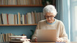 © kora studio - senior older retired woman grandmom  working on laptop emailing her family members for the thanks giving and christmas plan , writing her project online