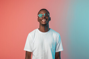 a nerdy black teen collage student male on pink and green plain background