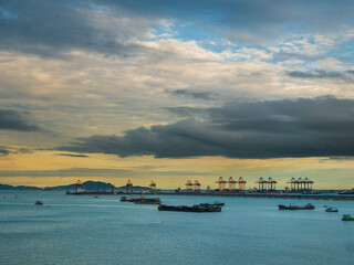 logistic shipping quay boat in twilight sky night engineering crane depot at logistic export termina