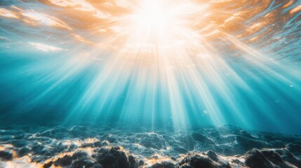 Wall Mural - Rays of sunlight stream through the ocean, creating a beautiful play of light in the clear blue water, revealing the underwater landscape