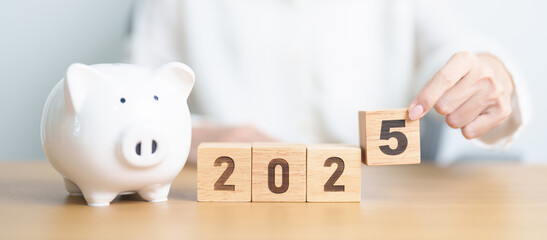 Wall Mural - Happy New Year 2025 with piggy bank. Resolution, Goals, Plan, Action, Money Saving, Retirement fund, Pension, Investment and Financial concept