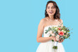 © Pixel-Shot - Beautiful bride with wedding bouquet on blue background