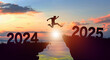 © Peachayatanomsup - Welcome merry Christmas and Happy new year in 2025. Man jumping across the gap from 2024 to 2025 cliff with Sunset and Twilight Sky background.
