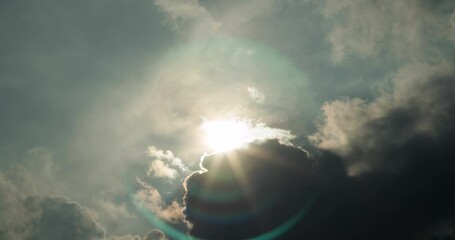 timelapse of the sun being obstructed by storm clouds