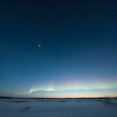 A cold, clear polar night sky with the faint glow of the sun on the horizon and a sky full of stars and aurora lights shimmering
