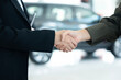 © just2shutter - Close Up Of Businesswoman Shaking Hands With Saleswoman At Car Showroom