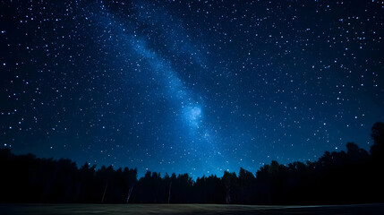 A Night Sky Photography Capturing the Milky Way with a Silhouetted Forest in the Foreground