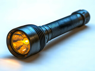 A black flashlight with a yellow beam, showcasing its modern design and functionality on a white background.