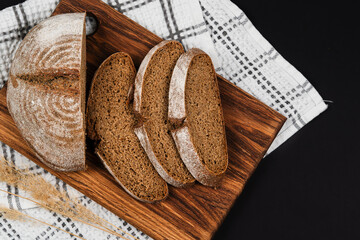 Slices of bread on a blackboard in close-up. Bread top view.