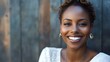 © Jojo* - Close-up Portrait of a Smiling Woman with Short Curly Hair