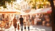 © Khukrit - Enchanting Family Stroll Through Picturesque Town Square on Warm Afternoon