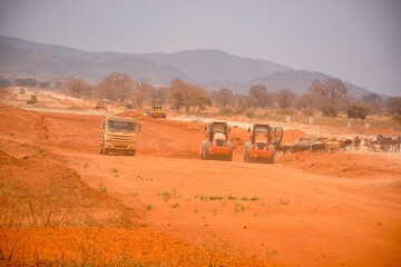 heavy machines at work in sand storm 