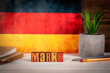 Wall Mural - brand. text in german. alphabet blocks on a white painted wooden background