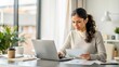 © Htet Wai Phyo - Documents, finance and woman with laptop in home office for debt budget, taxes and remote work. Freelance, accounting and female online for savings, review or analysis, development or business growth