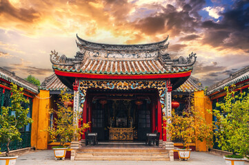 Wall Mural - Beautiful Asian Vietnamese temple on the Buddhist pagoda in old town in Hoi An city in Vietnam in Asia at sunset in summer