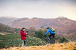 © Halfpoint - Cyclist is filming video, riding in nature and cameraman with a camera is capturing his adrenaline ride.