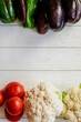 © Екатерина Абатурова - fresh vegetables - tomatoes, bell peppers , cauliflower, eggplant on a light background. the concept of healthy eating. vegetarianism. detox