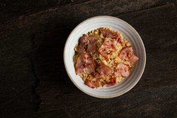 arlic fried rice with  with bacon  and egg in white bowl