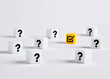 © Cagkan - Yellow check mark cube surrounded by question mark cubes
