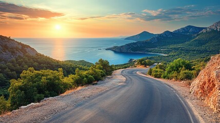 Winding road leads to ocean view. This photo is perfect for travel blogs and social media posts.