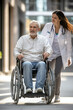 © Miljan Živković - Senior man in wheelchair with nurse take care of him