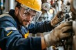 © ChaoticMind - A worker in protective gear smiles as he maintains complex factory machinery indoors, reflecting his expertise and the satisfaction derived from technical work.