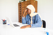 © ADDICTIVE STOCK - Black female doctor wearing hijab feeling stressed at work