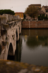 Discover the iconic Ponte di Tiberio, a Roman bridge spanning the River Marecchia in Rimini, Italy. Built in 20 AD, this majestic structure is a testament to Roman engineering and a must-see