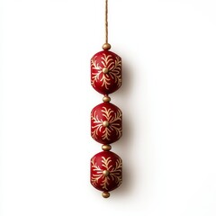 Wall Mural - Decorative firecracker string with red and gold details hanging vertically isolated on white background 